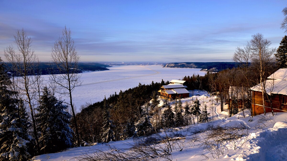 View of the Cap au Leste outfitter in winter with the Saguenay in the background