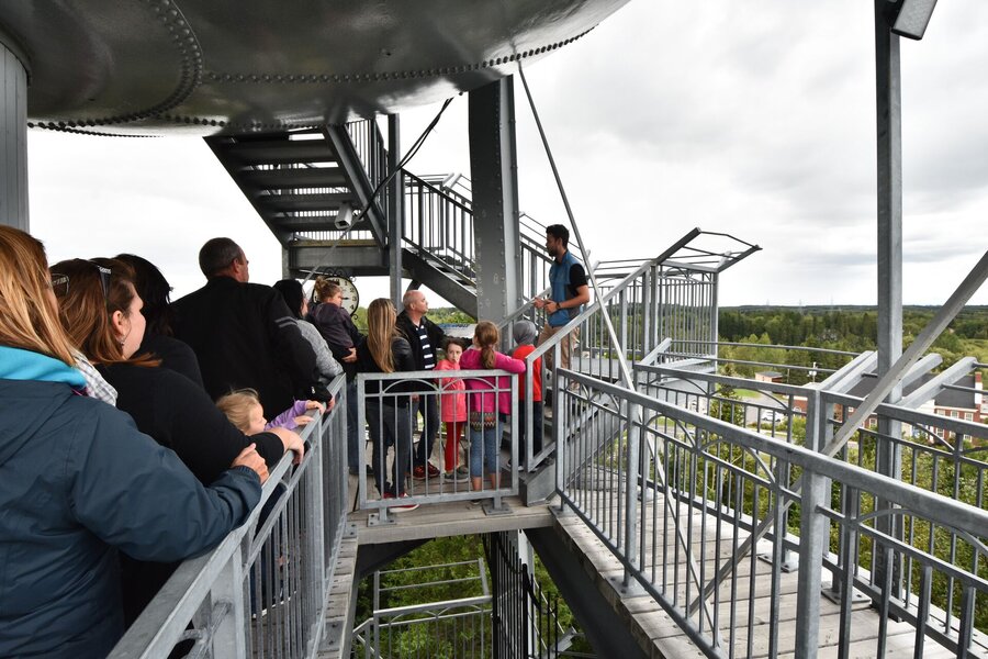 Guide a group up the stairs of the water tower at the Odyssey of Builders