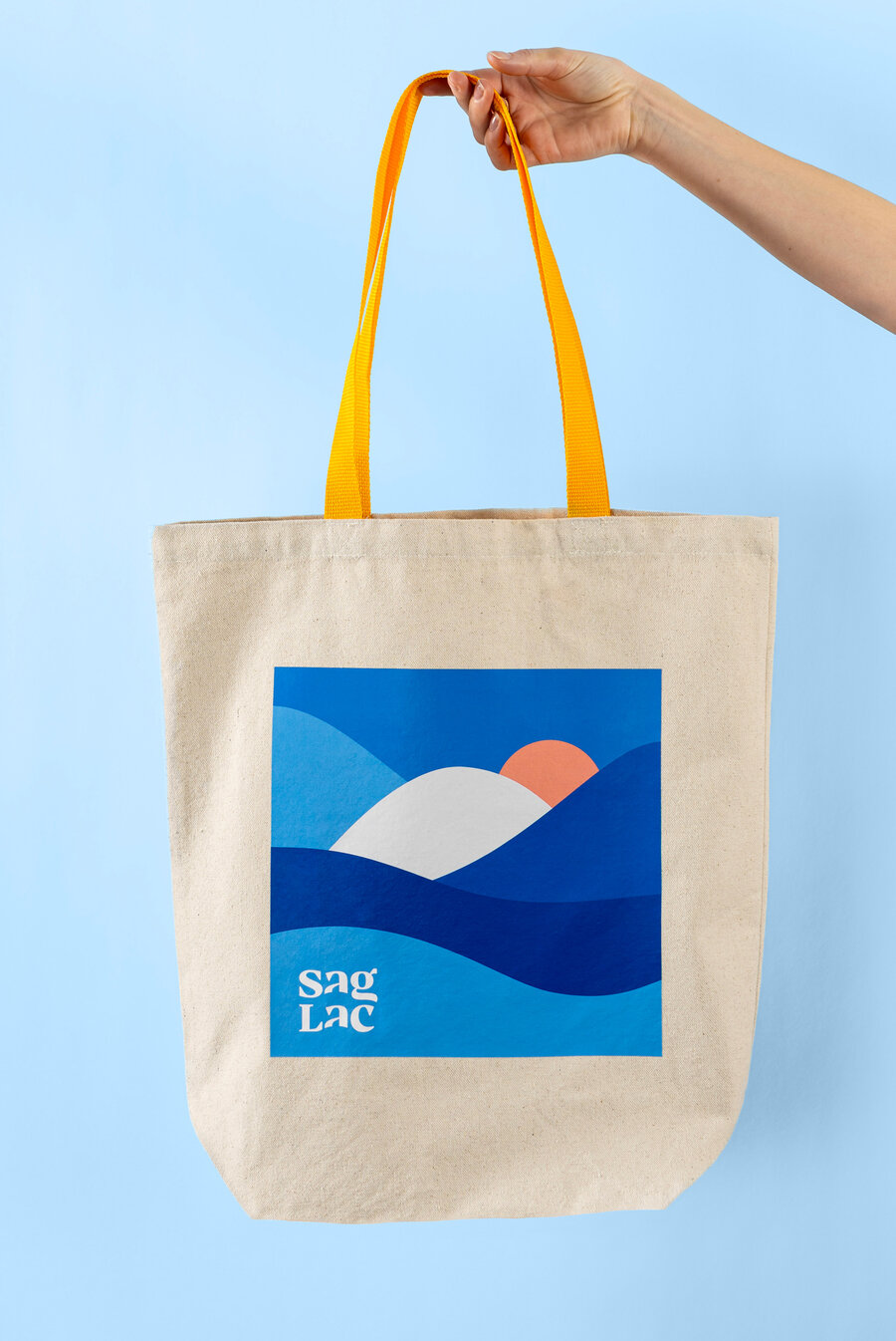 Sac en toile SagLac tenu par une anse jaune
