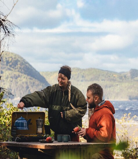Two campers cooking by the Saguenay Fjord