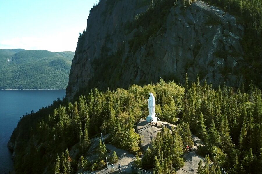 Statue of the Virgin Mary on a promontory overlooking the Saguenay Fjord