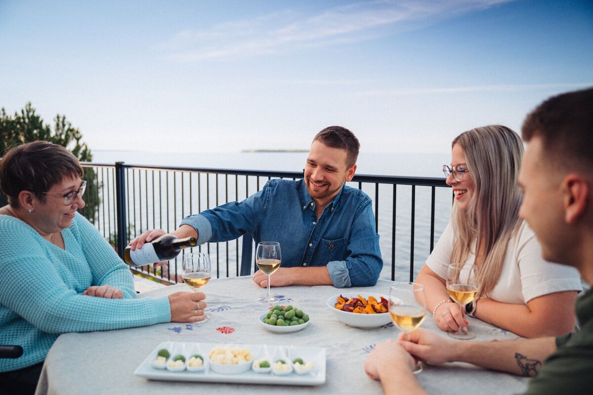 People sharing local wine at La Bonté DiVigne terrace