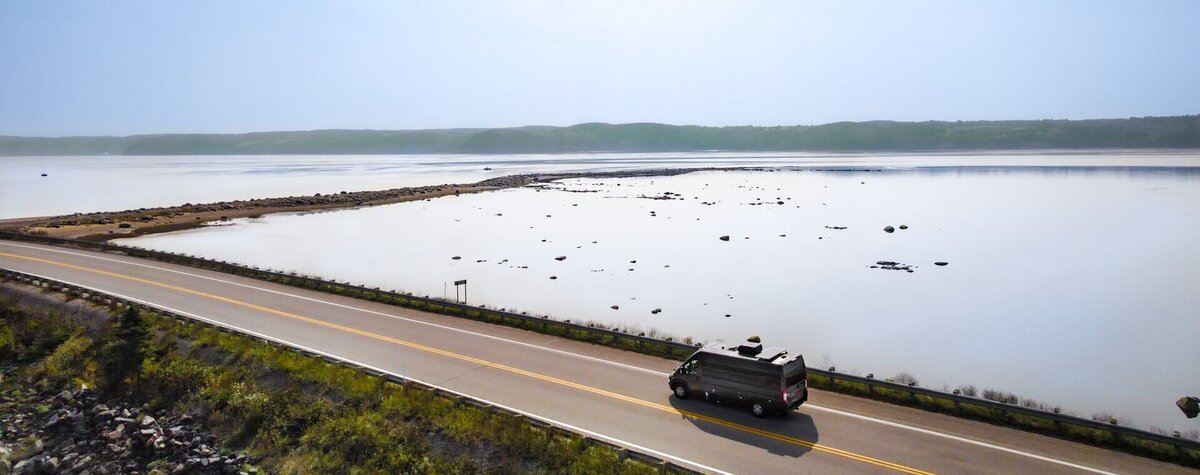 Minivan on the Route du Fjord with the Saguenay River